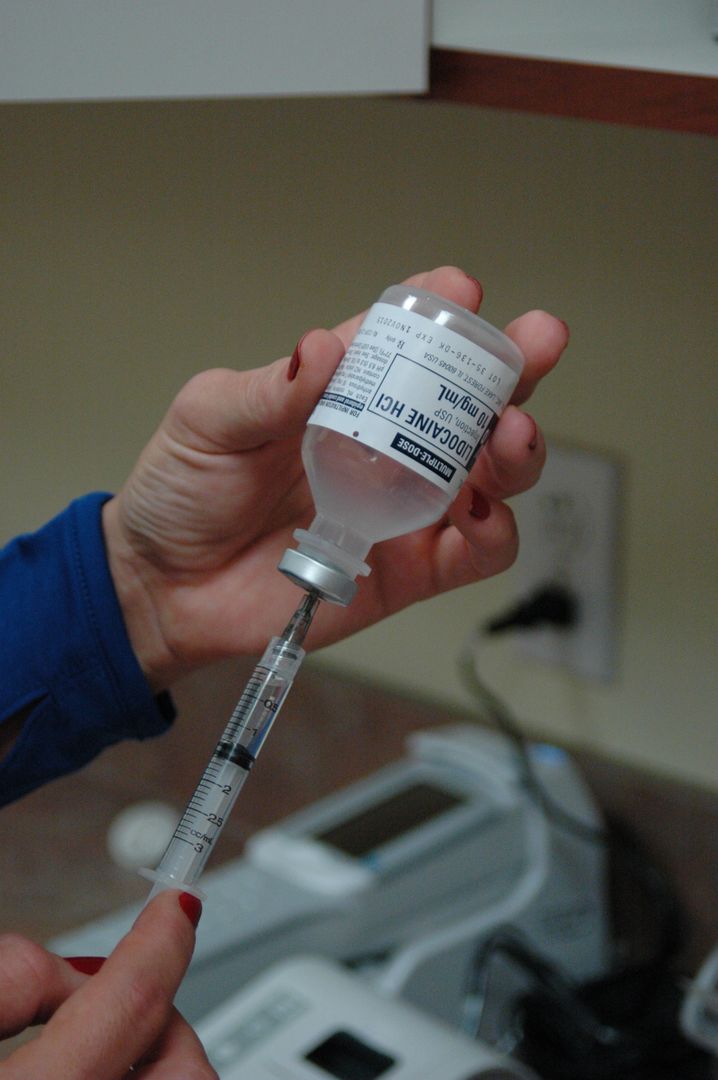 a person holding a syringe - Free Images, Stock Photos and Pictures on Pikwizard.com