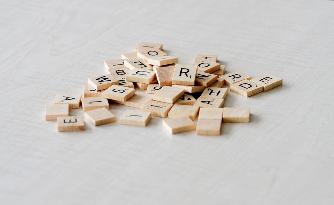 Letters of the alphabet printed on square wooden pieces