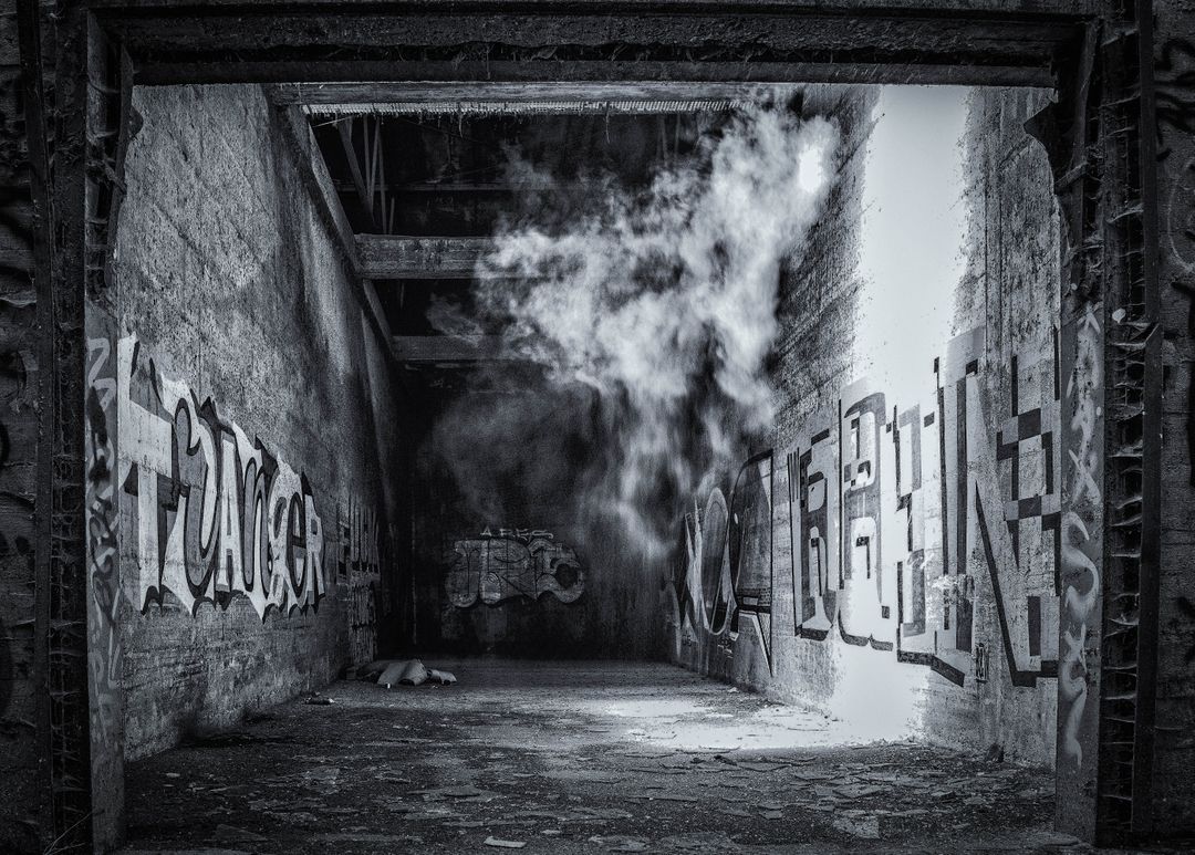 a dark tunnel with graffiti on it - Free Images, Stock Photos and Pictures on Pikwizard.com