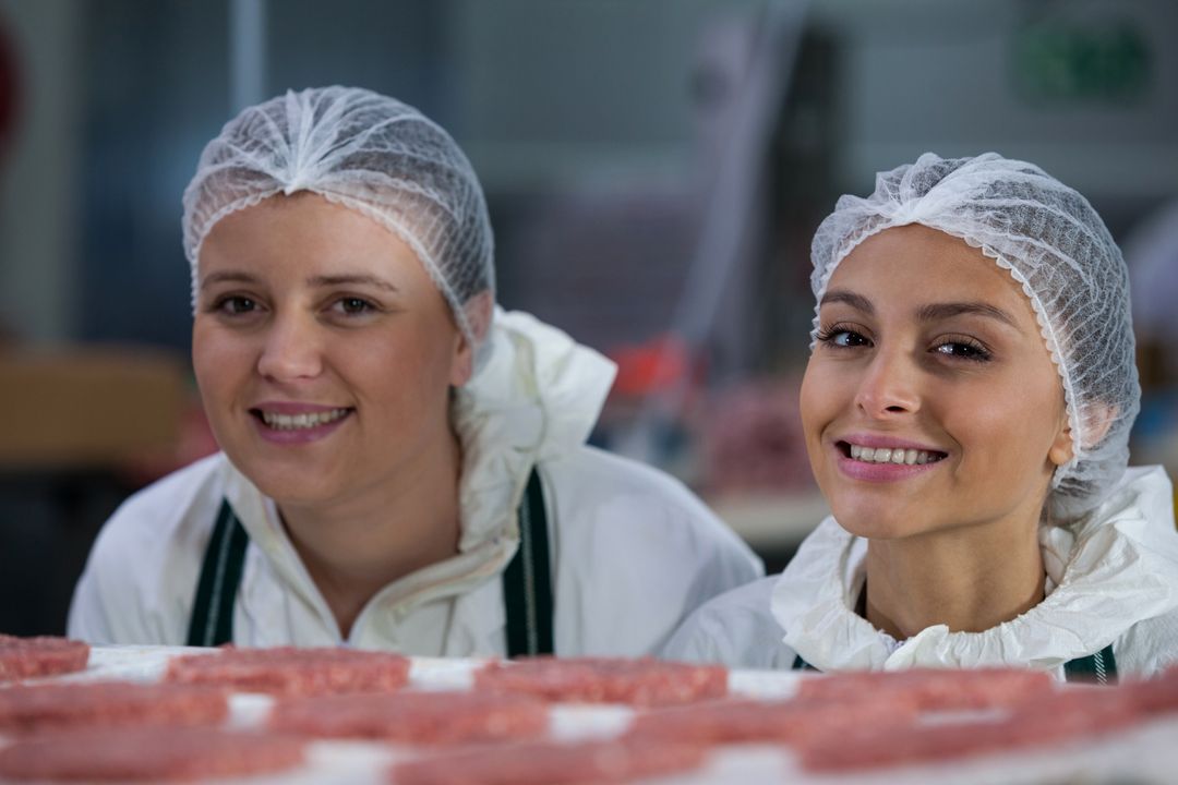 Female butchers at meat factory - Free Images, Stock Photos and Pictures on Pikwizard.com