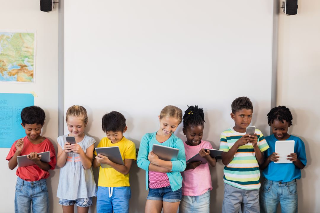 Image of children standing and watching videos on their tablets - Meaning and use of hero image in web design - Image