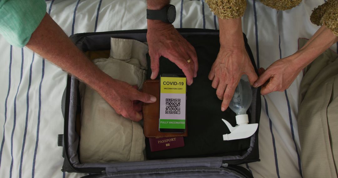 Hands of caucasian senior couple packing covid vaccinate passport into suitcase - Free Images, Stock Photos and Pictures on Pikwizard.com