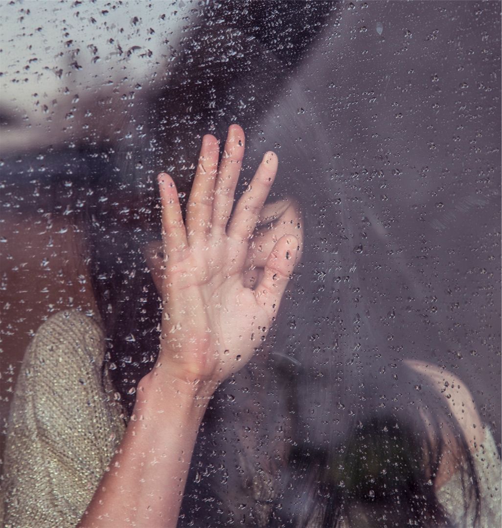 Woman's hand touching rainy window expressing solitude - Download Free  Image from Pikwizard