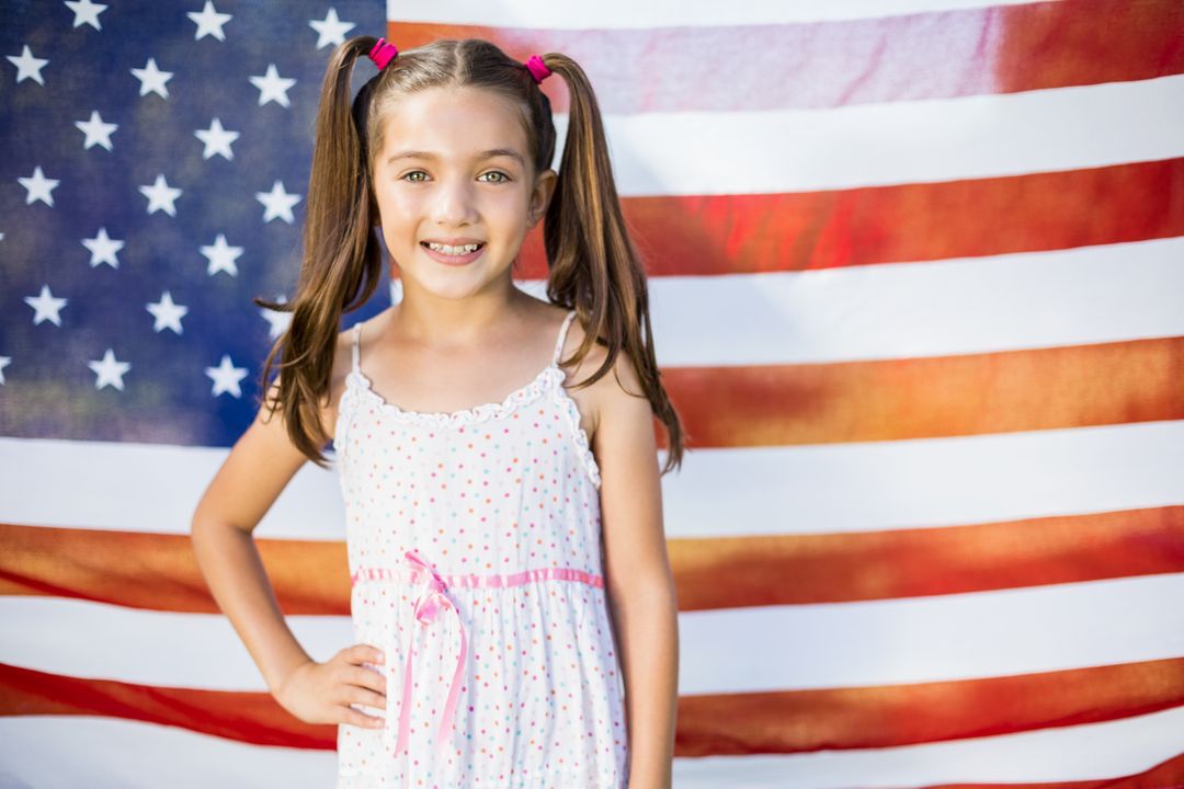 Young girl in front of American flag - Free Images, Stock Photos and Pictures on Pikwizard.com