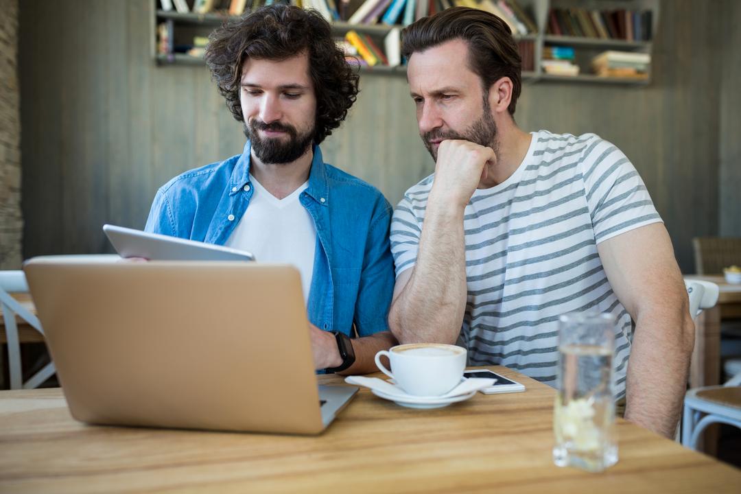 Two colleagues at an informal meeting in a cafe - Tips on how to decide on the type of content strategy that will best suit your needs - Image