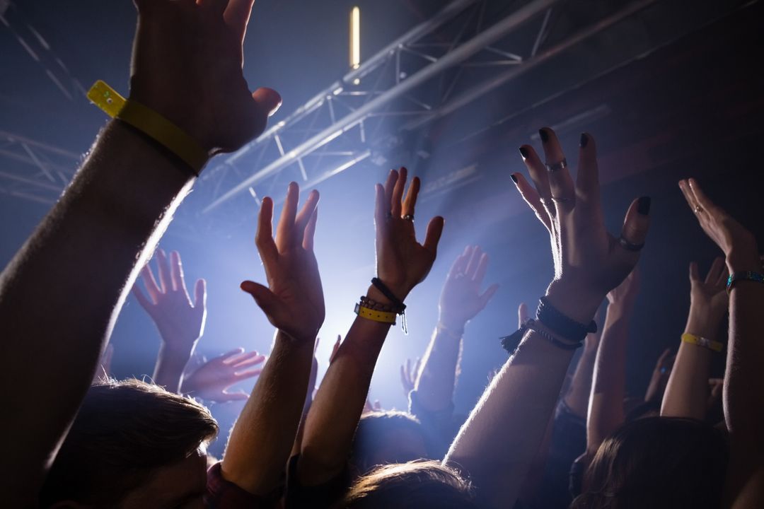 Hands up in the air at a concert