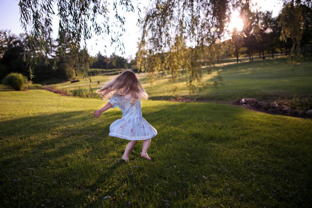 a little girl running in the grass - Free Images, Stock Photos and Pictures on Pikwizard.com