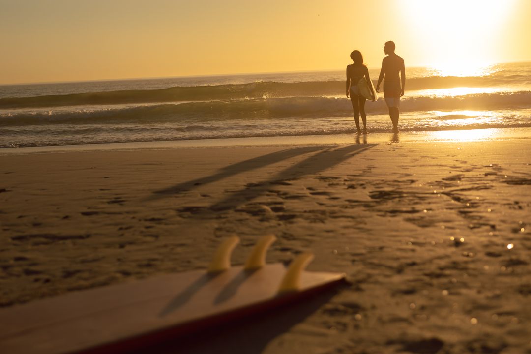 A Couple Walking on the Beach · Free Stock Photo