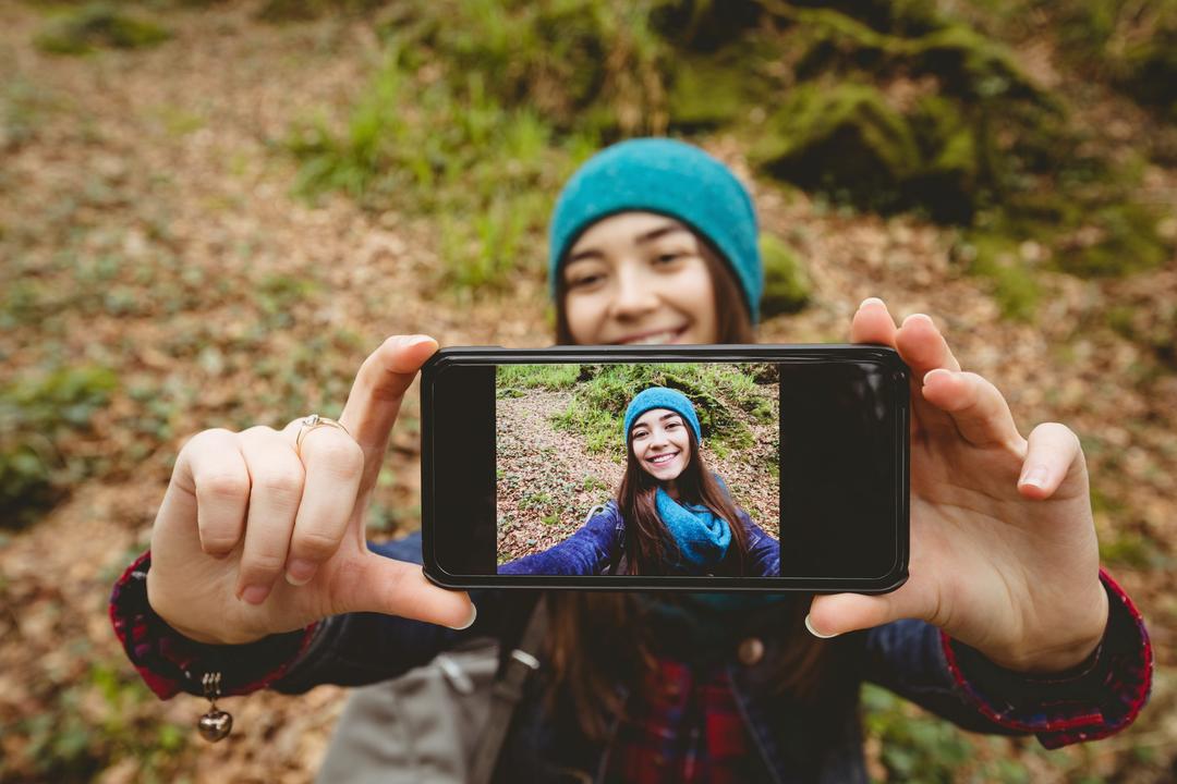 Woman Taking a Selfie with a Man Using a Camera · Free Stock Photo