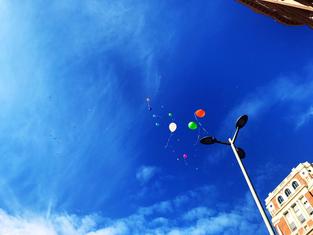 a street lamp with balloons - Free Images, Stock Photos and Pictures on Pikwizard.com