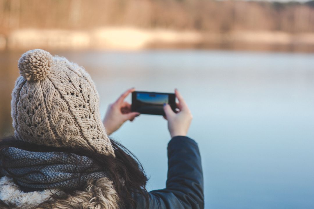 Image of a Woman Taking a Picture of the view with Her Smartphone 
