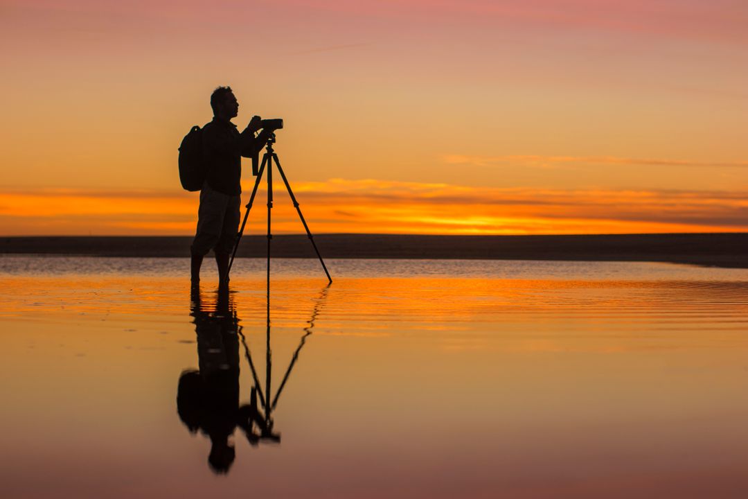 sunset landscape of photographer taking image