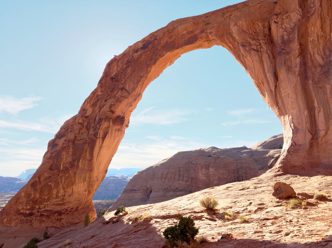 a large arch in the desert - Free Images, Stock Photos and Pictures on Pikwizard.com
