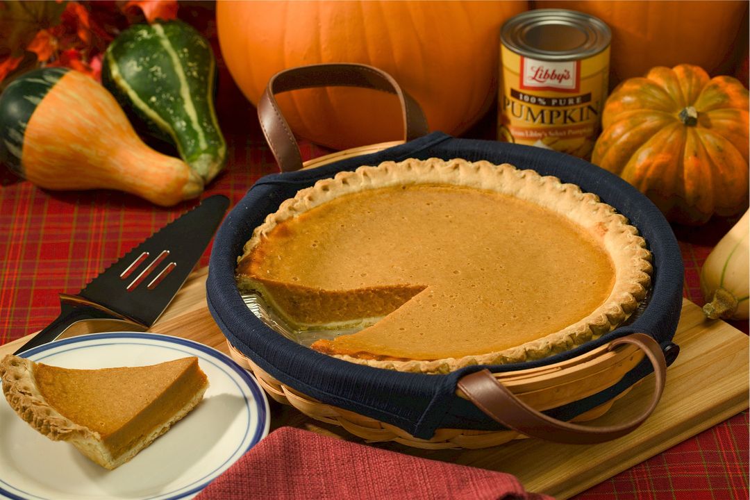 a pumpkin pie with a slice missing - Free Images, Stock Photos and Pictures on Pikwizard.com
