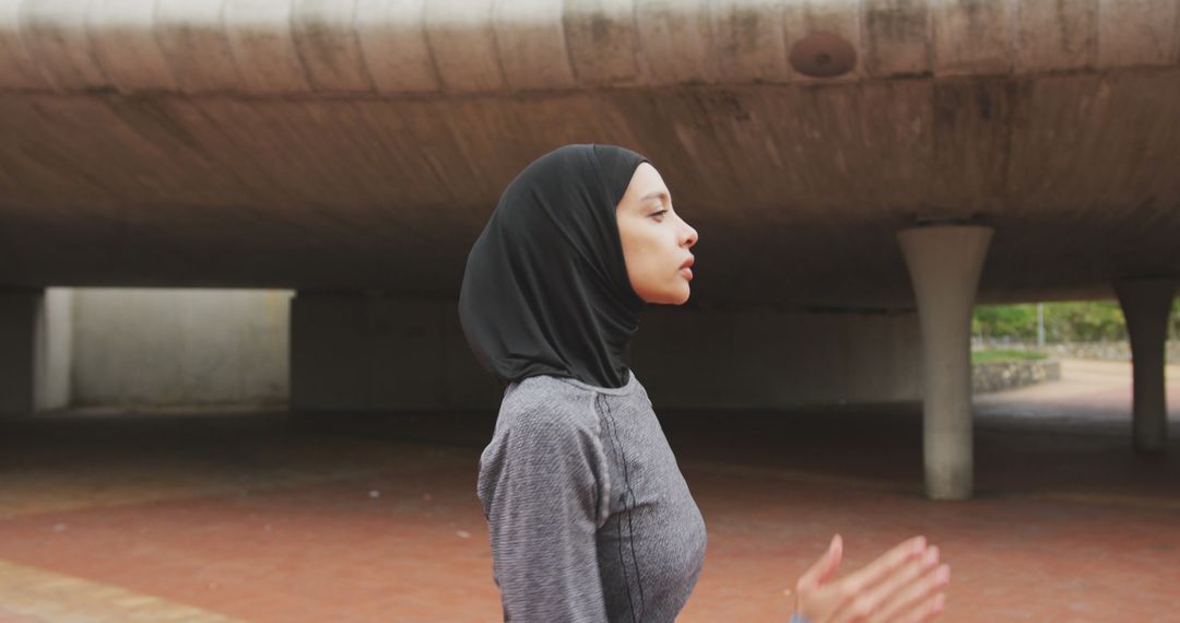 Side view of woman wearing hijab running  - Free Images, Stock Photos and Pictures on Pikwizard.com
