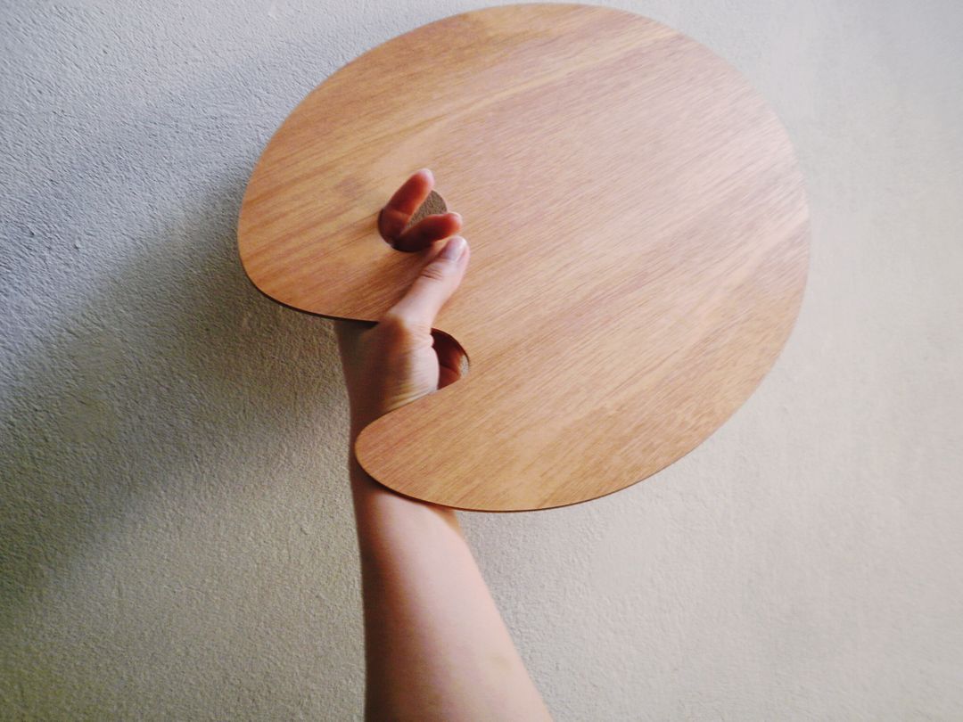 a person holding a wooden plate - Free Images, Stock Photos and Pictures on Pikwizard.com