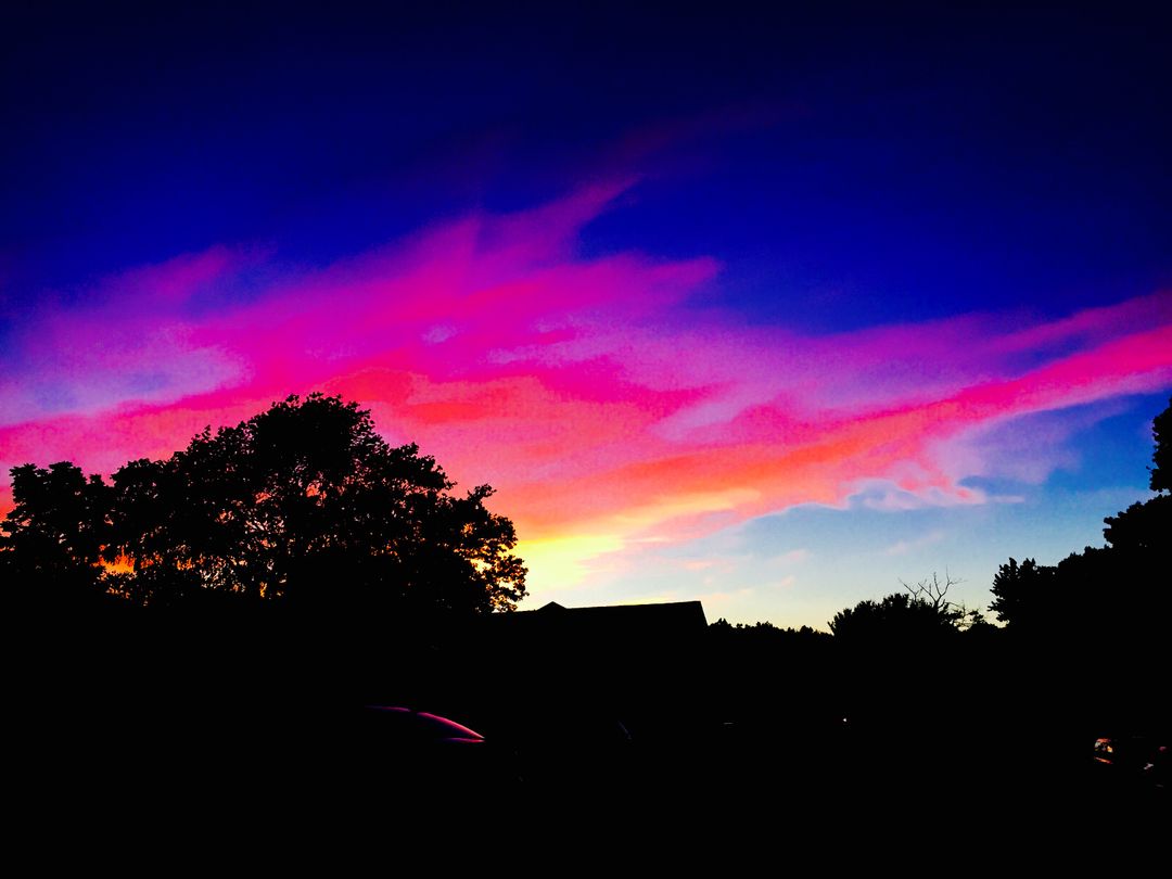a sunset with colorful clouds - Free Images, Stock Photos and Pictures on Pikwizard.com