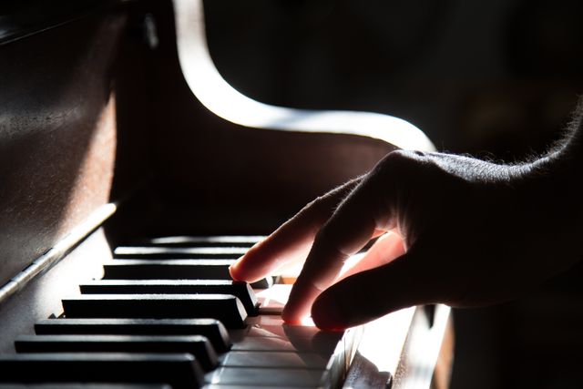 a person playing a piano - Download Free Stock Photos Pikwizard.com