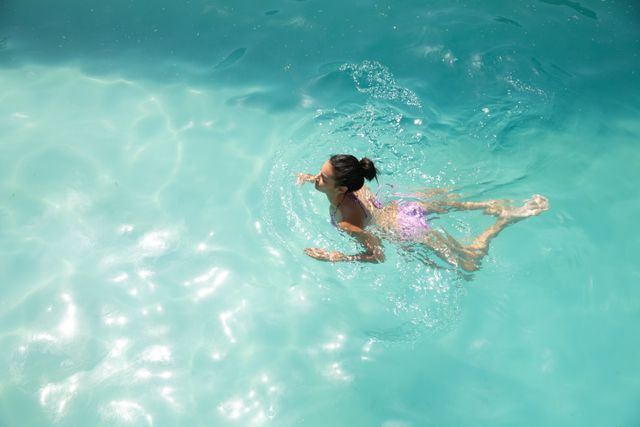 Woman swimming in the pool - Download Free Stock Photos Pikwizard.com