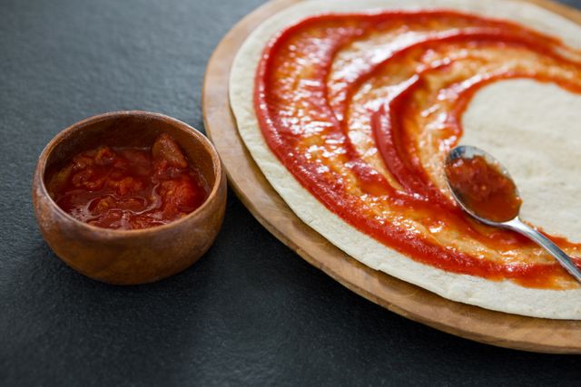 Pizza dough with tomato sauce - Download Free Stock Photos Pikwizard.com