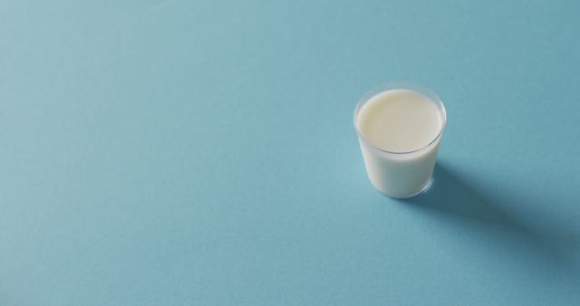 Image of glass of fresh milk over blue background - Download Free Stock Photos Pikwizard.com