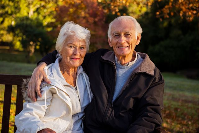 Elderly couple sitting on a bench - Download Free Stock Photos Pikwizard.com