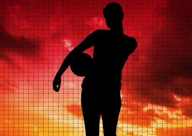 Silhouette of player holding a ball against net and sky in background - Download Free Stock Photos Pikwizard.com