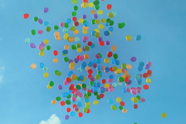 Blue Green Orange Yellow and Red Balloons on Blue Sky - Download Free Stock Photos Pikwizard.com