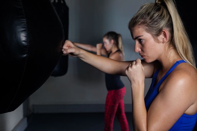 Women practicing boxing in fitness studio - Download Free Stock Photos Pikwizard.com