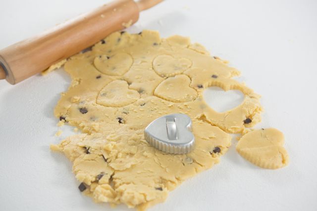 Rolling pin and cookie cutter on dough - Download Free Stock Photos Pikwizard.com
