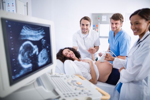 Doctor doing ultrasound scan for pregnant woman - Download Free Stock Photos Pikwizard.com