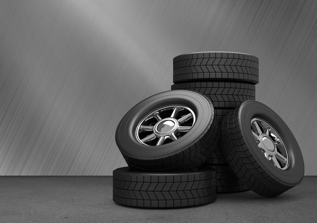 Stack of tyres kept on grey background