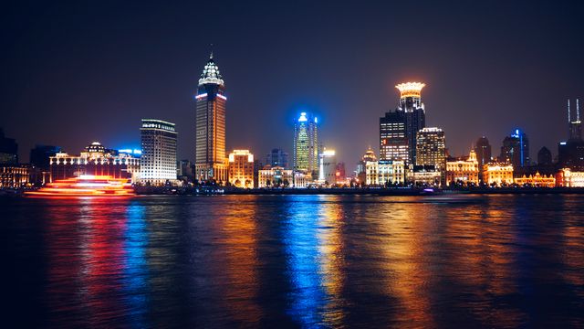Lighted City Skyline Near Body of Water during Nighttime - Download Free Stock Photos Pikwizard.com