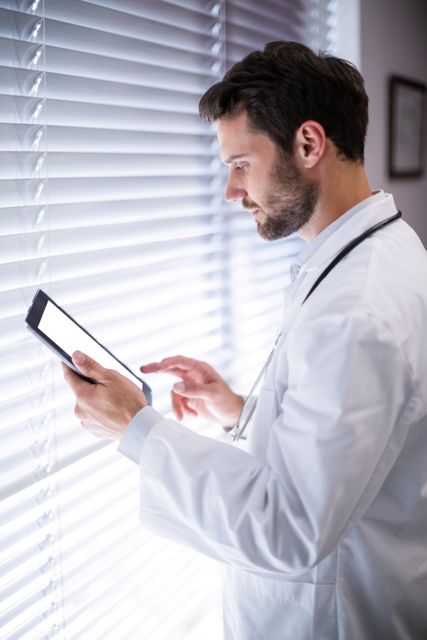 Male doctor using digital tablet - Download Free Stock Photos Pikwizard.com