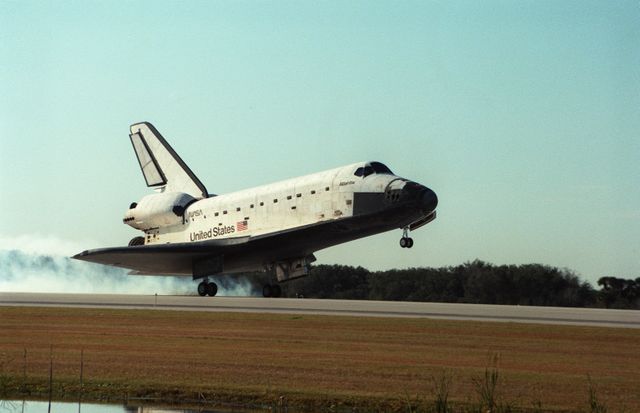 STS081-S-008 (22 Jan. 1997) --- The Space Shuttle Atlantis touches down on Runway 33 at the Kennedy Space Center (KSC) to conclude the fifth Shuttle-Mir docking mission.  Coming to a halt at 9:22:44 a.m. (EST), January 22, the mission also accomplished the return of astronaut John E. Blaha, cosmonaut guest researcher, who had been aboard Russia's Mir Space Station complex since mid September 1996. Blaha was replaced by Jerry M. Linenger during the five days of joint activities of the Mir-22 and STS-81 crewmembers while Atlantis and Mir were docked in Earth-orbit. At main gear touchdown, the mission's duration was 10 days, 4 hours and 55 minutes. This was the 34th space shuttle landing at KSC.  The crew aboard at landing included astronauts Michael A. Baker, commander; Brent W. Jett, Jr., pilot; Blaha; and mission specialists Marsha S. Ivins, Peter J. K. (Jeff) Wisoff and John M. Grunsfeld.