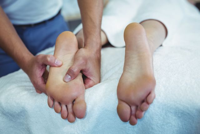 Physiotherapist giving foot massage to a woman - Download Free Stock Photos Pikwizard.com