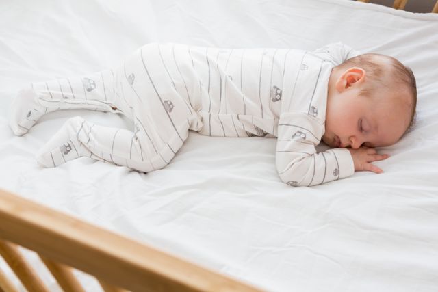 Baby boy sleeping on a cradle - Download Free Stock Photos Pikwizard.com