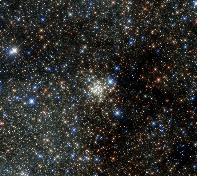 This NASA/ESA Hubble Space Telescope image presents the Arches Cluster, the densest known star cluster in the Milky Way. It is located about 25,000 light-years from Earth in the constellation of Sagittarius (The Archer), close to the heart of our galaxy, the Milky Way. It is, like its neighbor the Quintuplet Cluster, a fairly young astronomical object at between two and four million years old.  The Arches cluster is so dense that in a region with a radius equal to the distance between the sun and its nearest star there would be over 100,000 stars! At least 150 stars within the cluster are among the brightest ever discovered in the Milky Way. These stars are so bright and massive that they will burn their fuel within a short time (on a cosmological scale that means just a few million years). Then they will die in spectacular supernova explosions. Due to the short lifetime of the stars in the cluster the gas between the stars contains an unusually high amount of heavier elements, which were produced by earlier generations of stars.  Despite its brightness the Arches Cluster cannot be seen with the naked eye. The visible light from the cluster is completely obscured by gigantic clouds of dust in this region. To make the cluster visible astronomers have to use detectors which can collect light from the X-ray, infrared, and radio bands, as these wavelengths can pass through the dust clouds. This observation shows the Arches Cluster in the infrared and demonstrates the leap in Hubble’s performance since its 1999 image of same object. Credit: NASA/ESA   <b><a href="http://www.nasa.gov/centers/goddard/home/index.html" rel="nofollow">NASA Goddard Space Flight Center</a></b> enables NASA’s mission through four scientific endeavors: Earth Science, Heliophysics, Solar System Exploration, and Astrophysics. Goddard plays a leading role in NASA’s accomplishments by contributing compelling scientific knowledge to advance the Agency’s mission.  <b>Follow us on <a href="http://twitter.com/NASAGoddardPix" rel="nofollow">Twitter</a></b>  <b>Like us on <a href="http://www.facebook.com/pages/Greenbelt-MD/NASA-Goddard/395013845897?ref=tsd" rel="nofollow">Facebook</a></b>  <b>Find us on <a href="http://instagrid.me/nasagoddard/?vm=grid" rel="nofollow">Instagram</a></b>