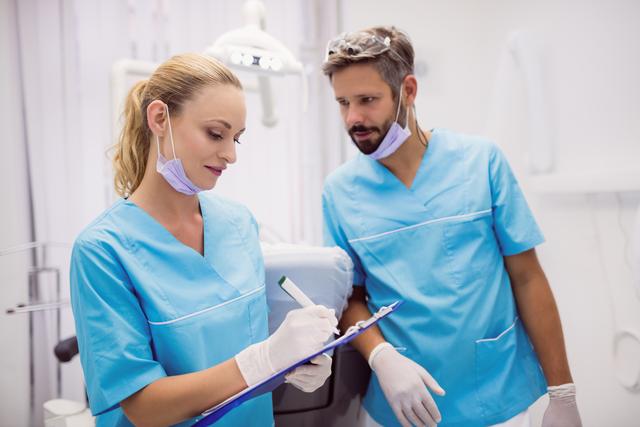 Dentists interacting with each other - Download Free Stock Photos Pikwizard.com