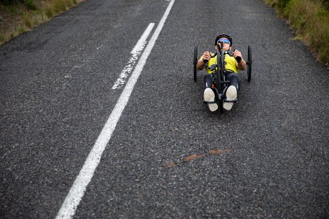 Man practicing wheelchair biking on the road - Download Free Stock Photos Pikwizard.com