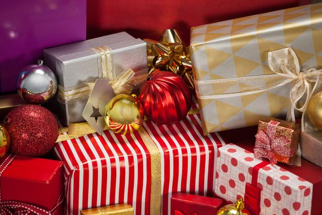 Close-up of wrapped gift boxes and baubles - Download Free Stock Photos Pikwizard.com