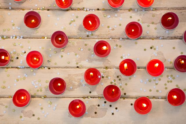 Candles burning on wooden plank - Download Free Stock Photos Pikwizard.com