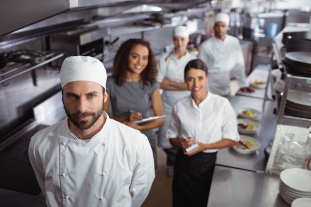 Restaurant manager with his kitchen staff - Download Free Stock Photos Pikwizard.com