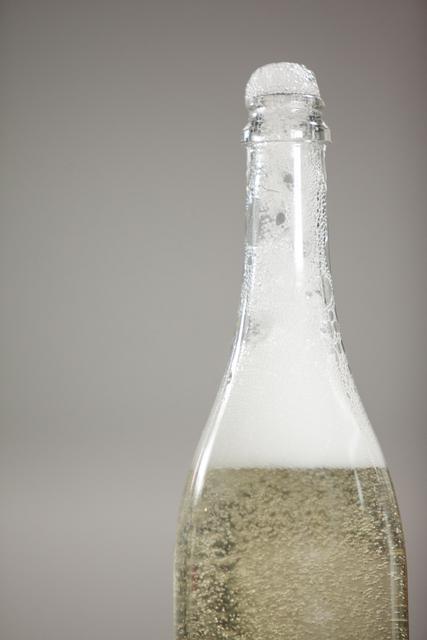 Close-up of froth flowing out of champagne bottle - Download Free Stock Photos Pikwizard.com