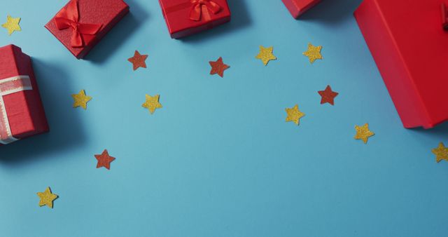 Image of christmas decorations with presents and copy space on blue background - Download Free Stock Photos Pikwizard.com