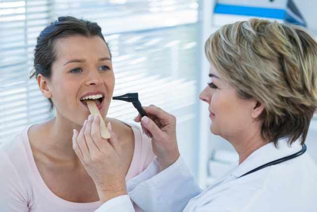 Doctor examining patients teeth with otoscope - Download Free Stock Photos Pikwizard.com