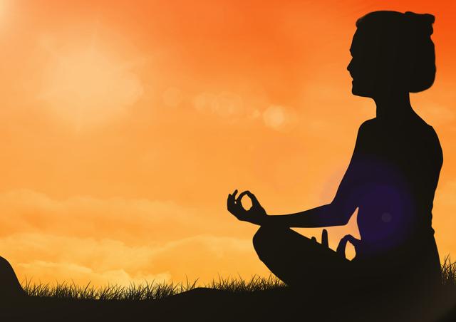 Silhouette of woman sitting for meditation on grass - Download Free Stock Photos Pikwizard.com
