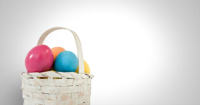 Easter eggs in basket in front of grey background - Download Free Stock Photos Pikwizard.com