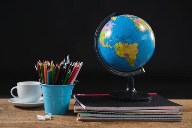 Various school supplies and globe on table - Download Free Stock Photos Pikwizard.com