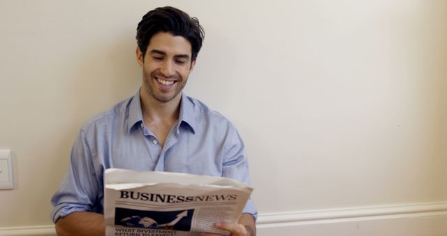 Portrait of smiling man reading business newspaper at home 4k - Download Free Stock Photos Pikwizard.com